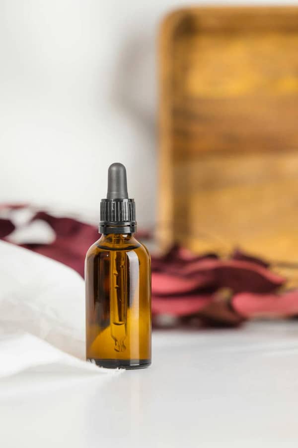 1 oz amber bottle of organic blue and black cohosh tincture for natural health support.